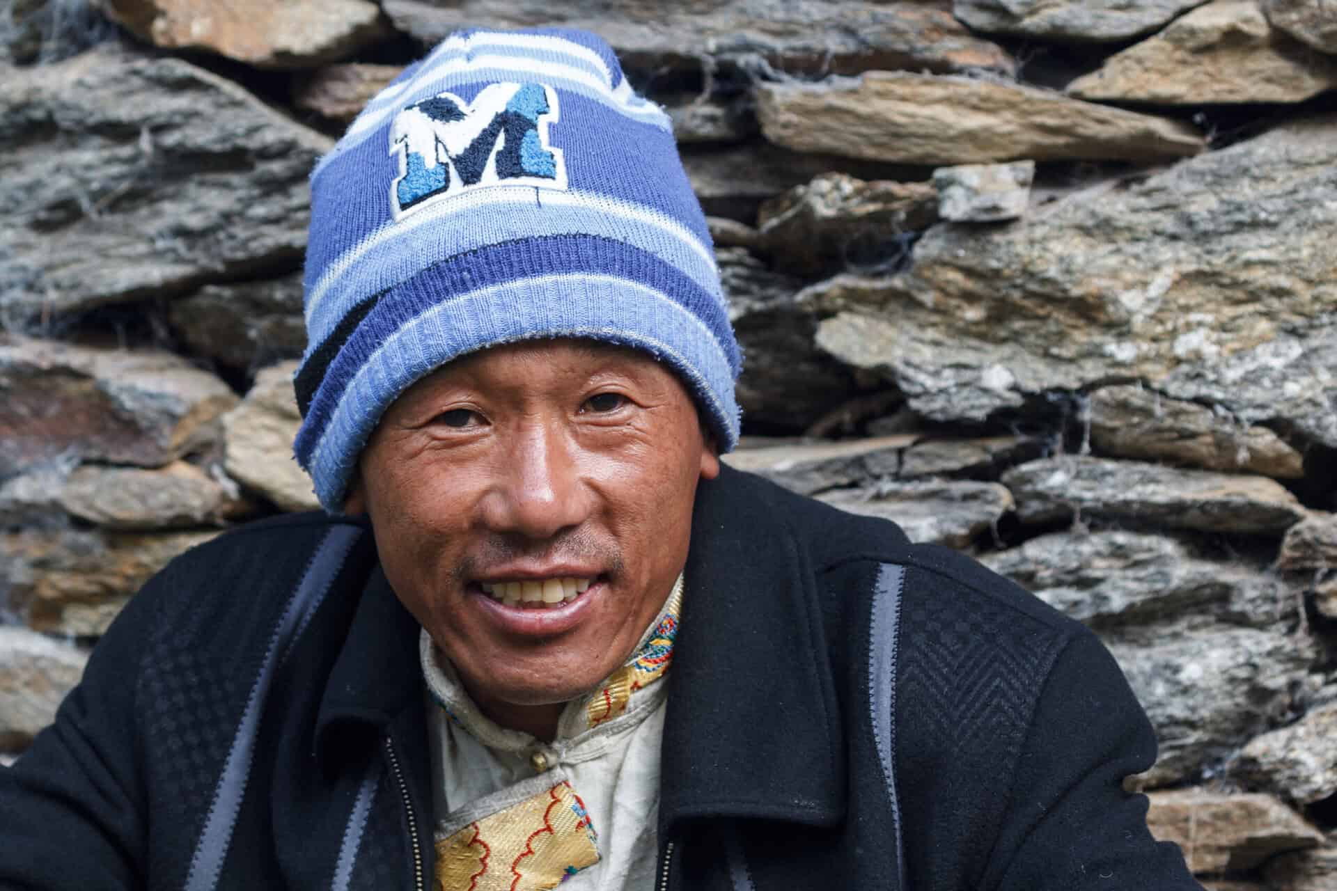 A man smiles for a photo.